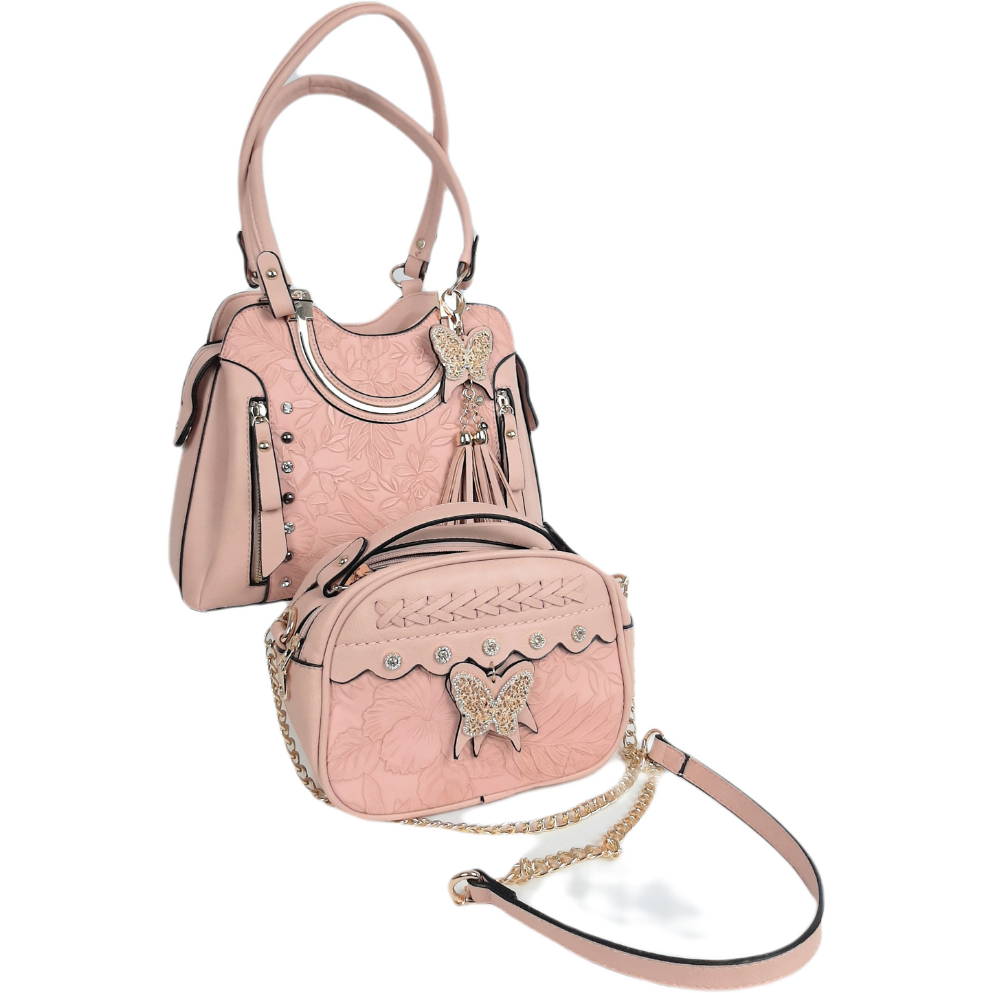 Two handbags for the price of one!  Stylish blush handbag with embossed leaf pattern, tassels, crystal detail and gold tone hardware.   Optional shoulder strap.